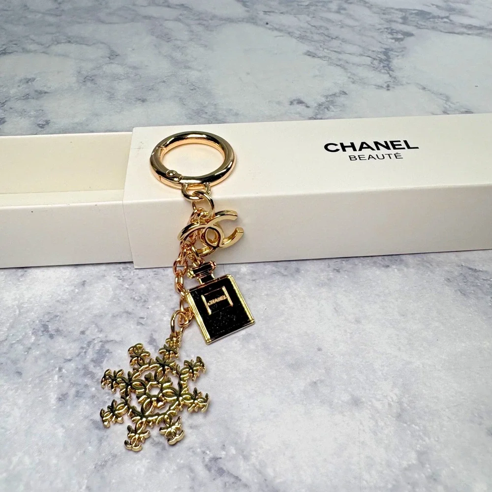 CHANEL Perfume Bottle CC Holiday Snow Flake Bag Charm Key Ring Chain Gold New